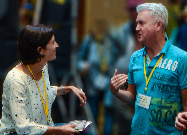 TAXI A&R team member Brooke Ferri (left) spends some time with member Von Newcomb after her panel wrapped up.